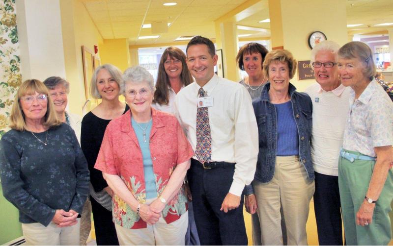 St. Andrews auxiliary members celebrate with Gregory Wing staff when the Gregory Wing received five stars from the U.S. Centers for Medicare and Medicaid Services. In front row, from left are Jenny Brown, Miriam Wade, St. Andrews Village Executive Director Michael Lee, Ginger Carr, Ellen Memory and Liz Furber.  In the back row, from left are, Judie Allen, St. Andrews Village Marketing Director Wendy Roberts, Gregory Wing Activity Director Jerie Phinney and Gregory Wing Nursing Director Cathy Raye.